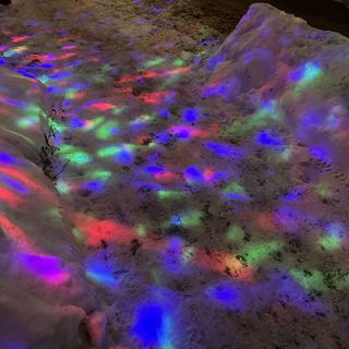 colorful nights on top of snow in the street